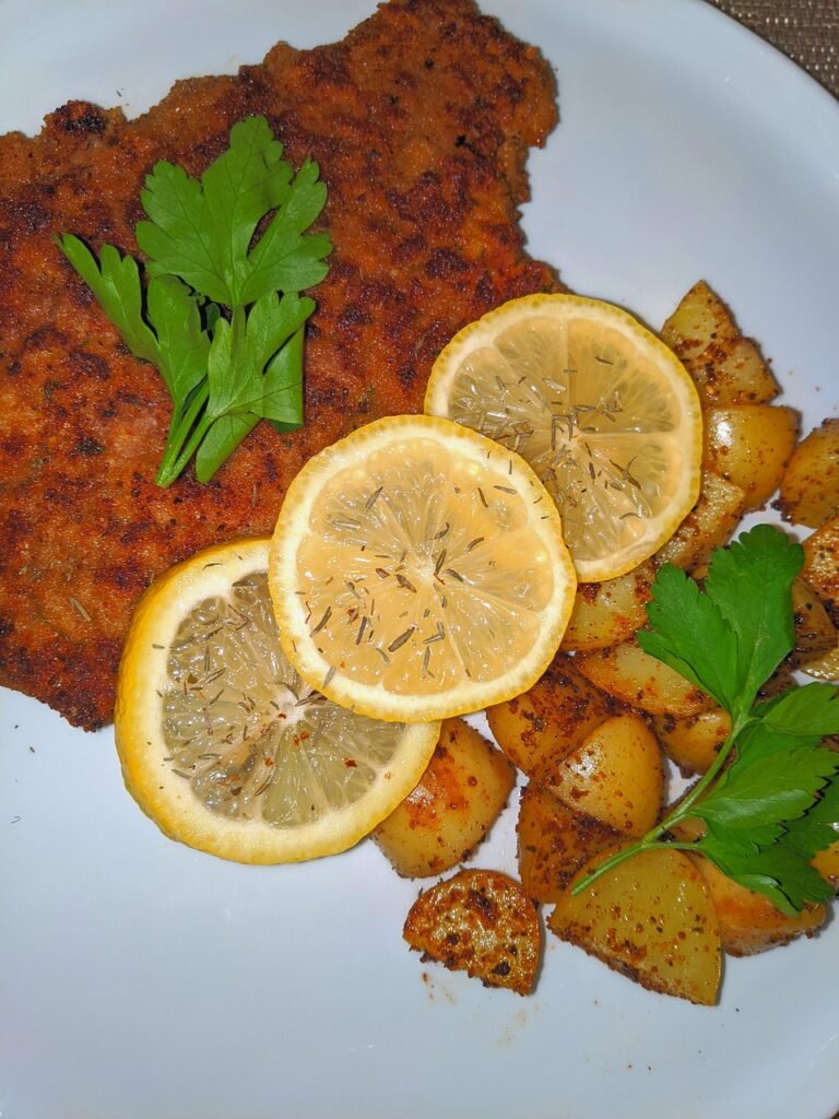 steak milanesa, steak, breaded steak, potatoes, lemon slices, dinner, food